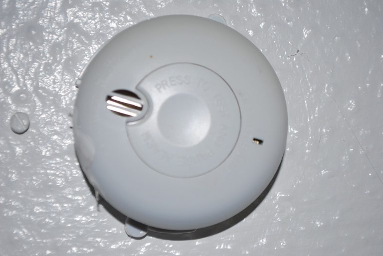Smoke Detector Beeping? 9 Causes & Fixes (2026 Guide)